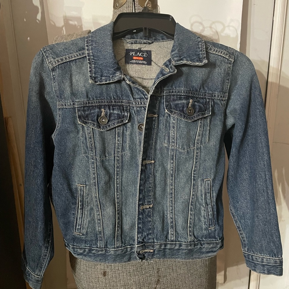 Upcycled kids jeans jacket with fabric “Stranger Things” design on the back.